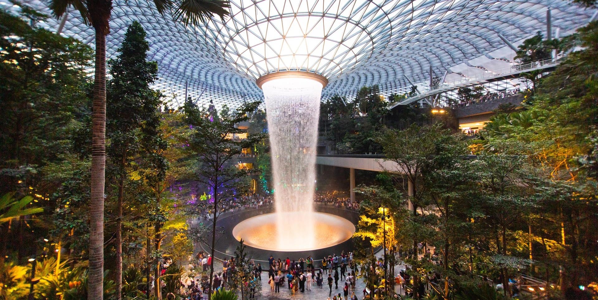 The world's tallest indoor waterfall, the Rain Vortex, and a skytrain at the Forest Valley in Jewel Changi Airport